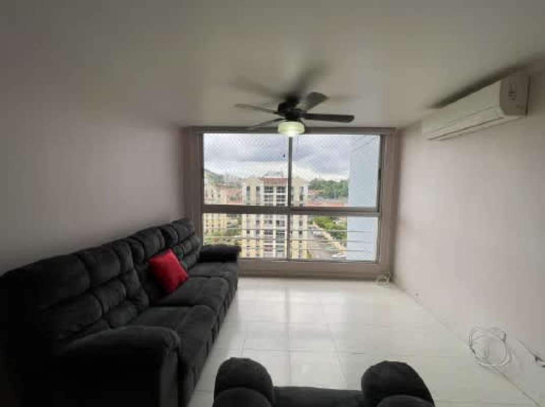 Living room with ceramic tile floor, ceiling fan, balcony view PH McGregor Heights Condado del Rey
