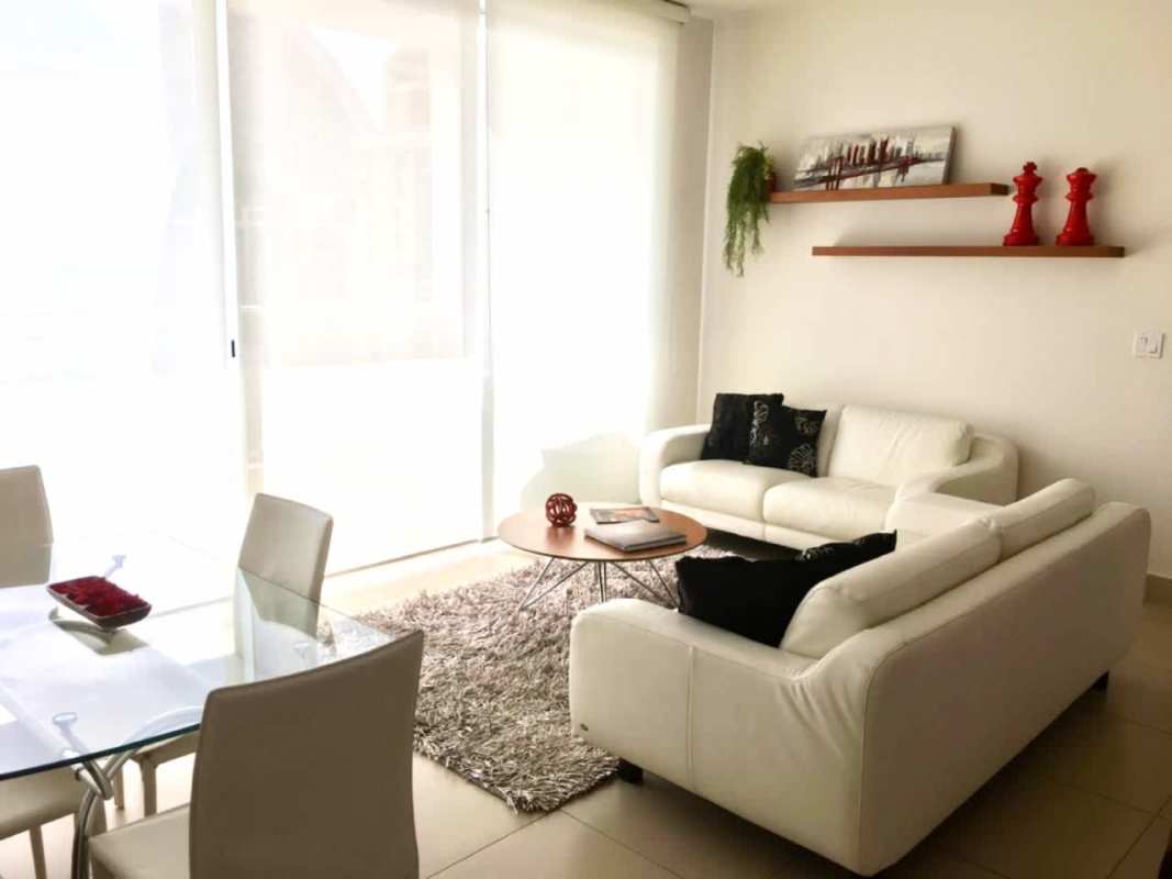 Open plan kitchen with granite countertops, appliances and breakfast bar in PH Dupont Punta Pacifica apartment