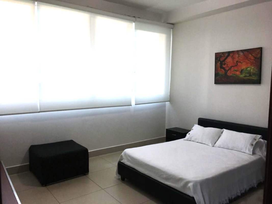 Spacious master bedroom with panoramic ocean view windows at PH Dupont Punta Pacifica