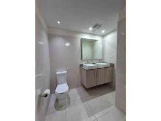 Modern granite countertop kitchen with appliances at PH Midrise in Panama Pacifico