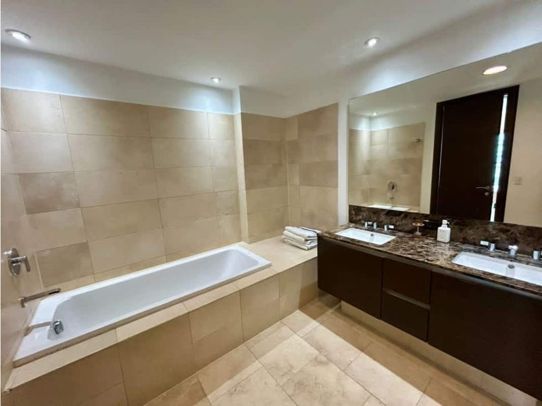 Luxury bathroom featuring double sink vanity, bathtub, and elegant finishes at PH TOC