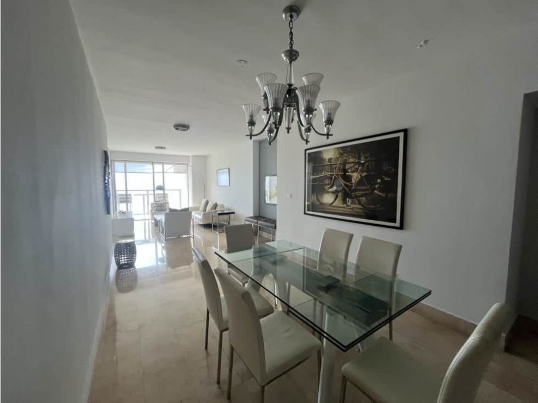Spacious living area with sliding door to balcony and panoramic sea views in Panama City luxury apartment