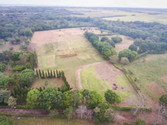 Spacious cleared cultivation acres along main Interamericana highway near resorts Rio Hato