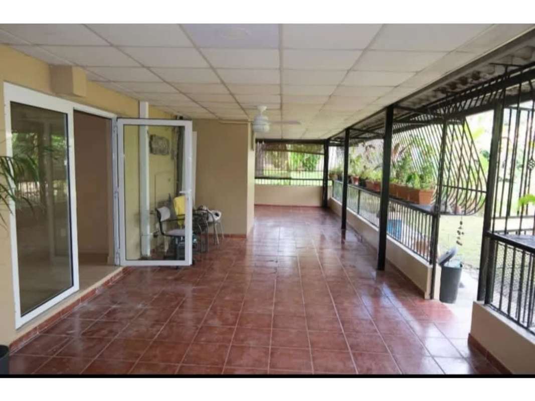 Living area with glass doors to balcony, tile floors, ceiling fan at PH Residencial Clayton