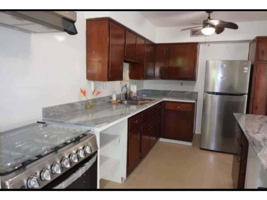 Residential exterior with lush gardens, mature trees and pathway in PH Residencial Clayton Panama