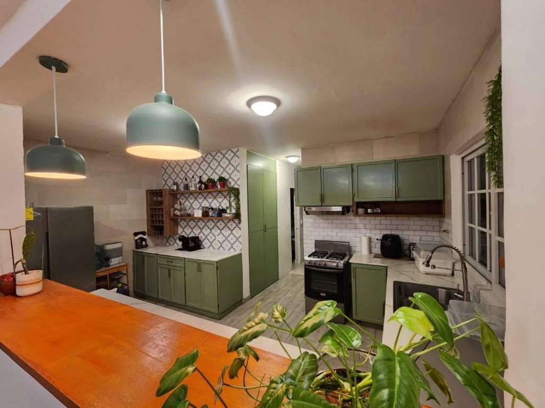 Bright entrance foyer with tile floors and staircase Costa Sur Panama