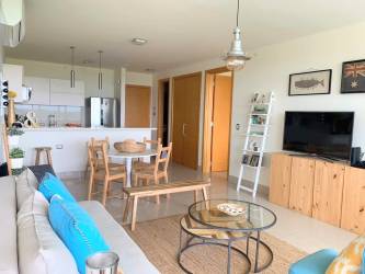 Open concept living dining kitchen with coastal decor Ibiza Beach Panama