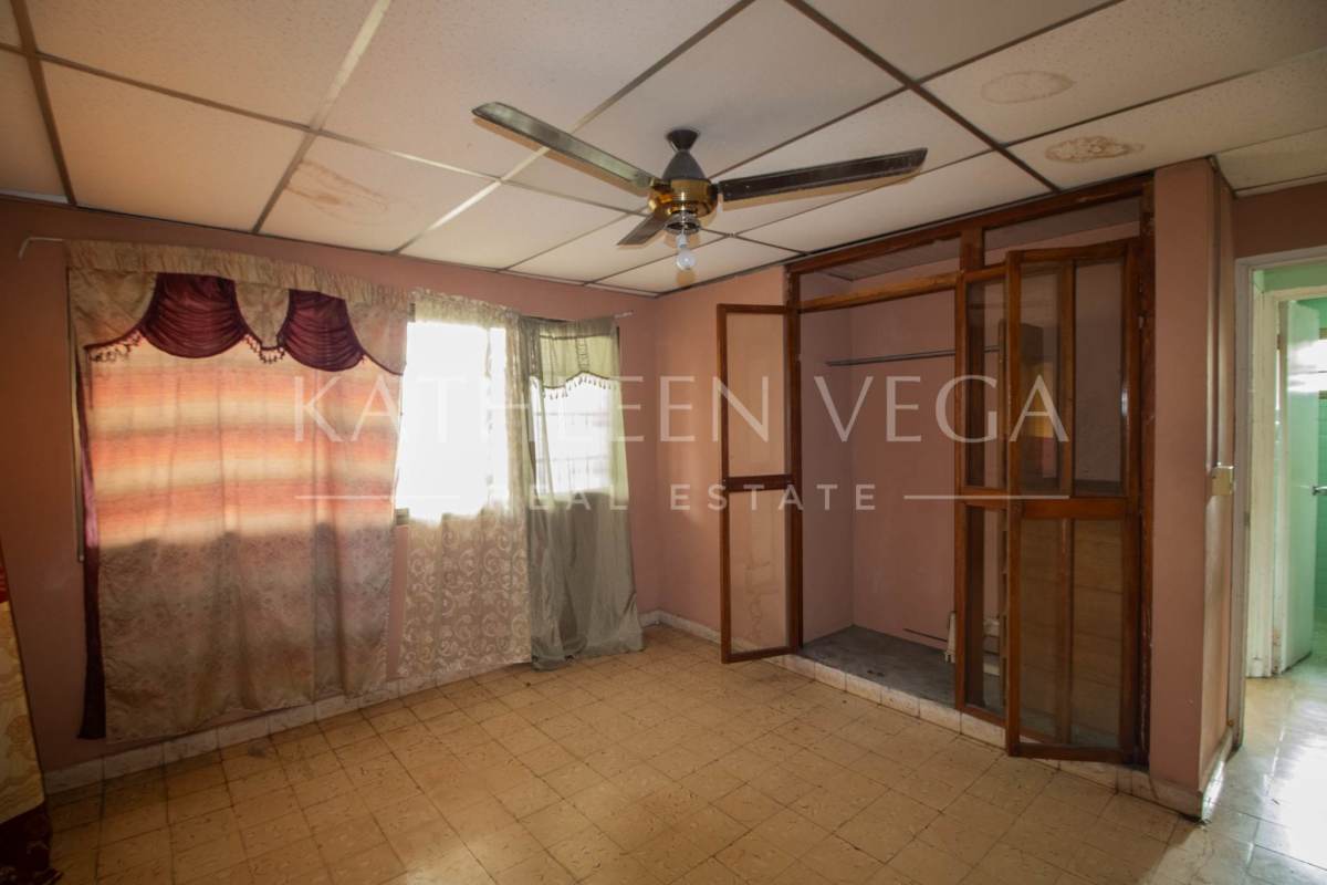 Bedroom with tile floor, ceiling fan, built-in closet frame in Carrasquilla house Panama