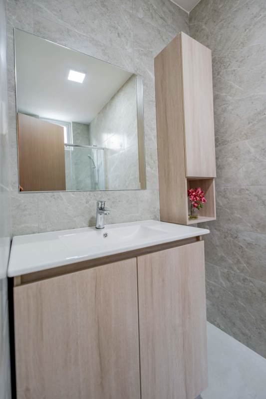 Contemporary bathroom glass enclosed shower and quartz counters PH Condado Gardens