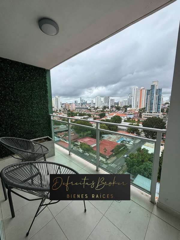 Private balcony with glass railings and panoramic skyline views in PH Emporium Tower Panama