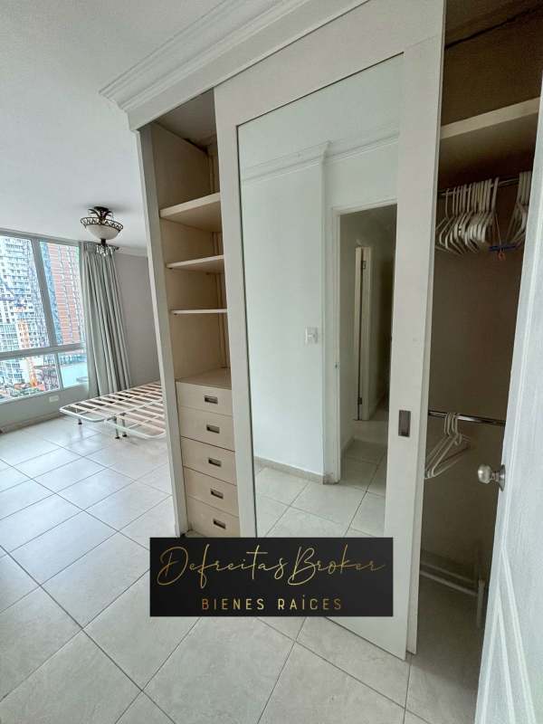 Bedroom with large window, built-in mirrored wardrobe, ceiling fan PH Emporium Tower Panama City