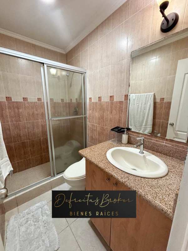 Modern bathroom granite countertop glass shower enclosure Emporium Tower Panama