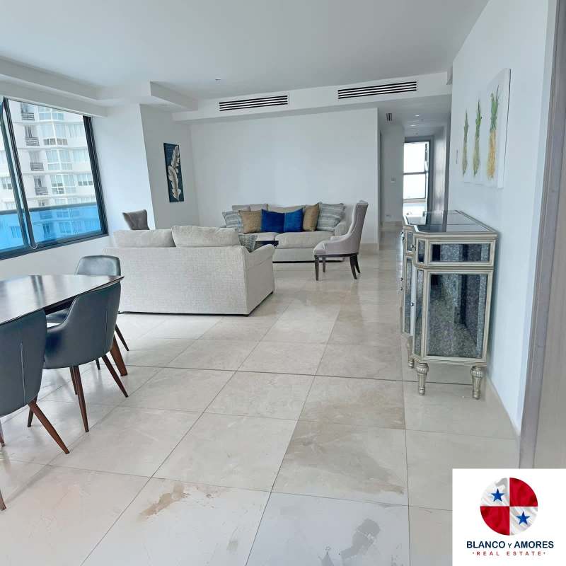 Spacious furnished living dining room with floor-to-ceiling windows and porcelain tile floor, Punta Paitilla Panama