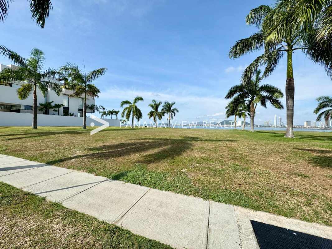 Palm-lined landscaped waterfront with walking path at Ocean Reef Islands Punta Pacifica Panama
