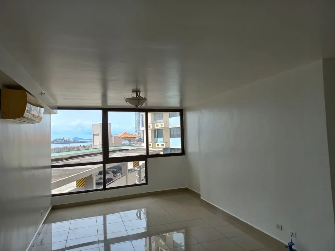 Tennis court surrounded by high-rises and gardens in PH San Francisco Bay Panama City