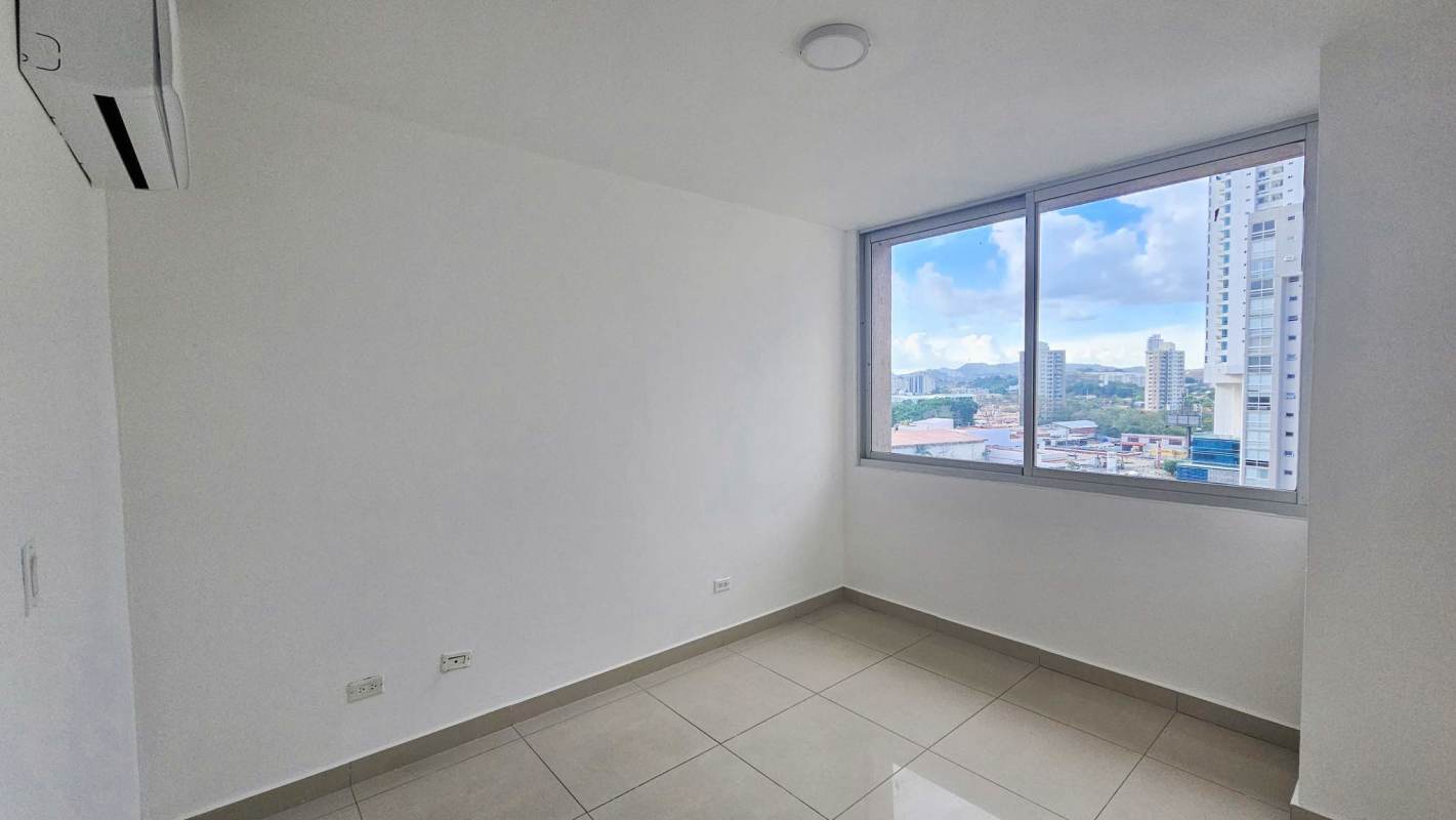 Spacious master bedroom with large window and balcony access PH Sevilla Tower Costa del Este Panama