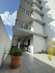 Spacious bedroom featuring tile floors, window view, built-in closet in PH Mosaic Panama Pacifico