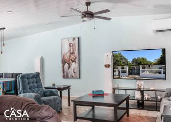 Bright living room with vaulted ceiling, tile floors in Dolega residence near Boquete