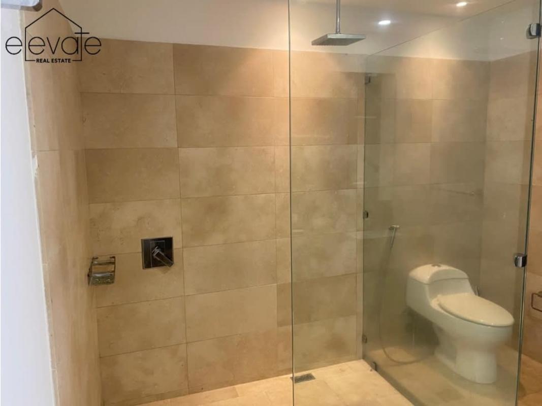 Marble bathroom with walk-in glass shower Ocean Club condo rental in Punta Pacifica Panama City