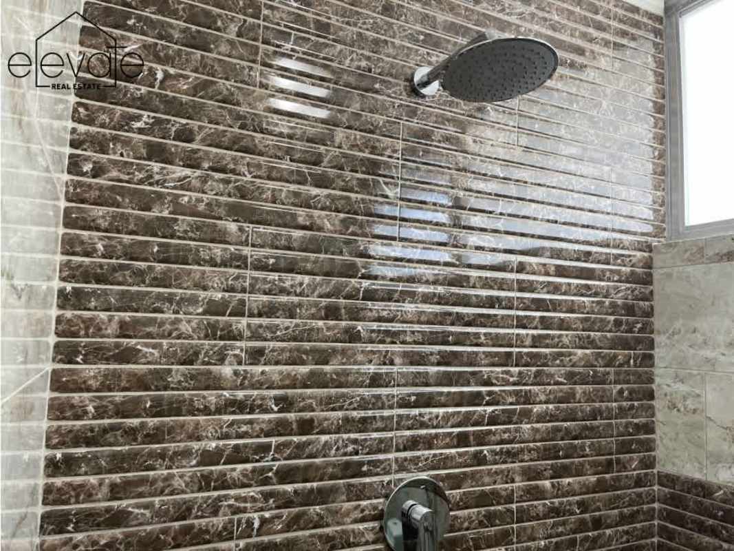 Marble tile shower with rain showerhead PH Entremares El Cangrejo Panama City