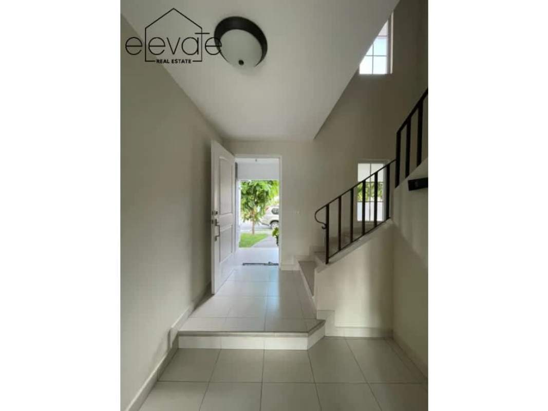 Entry foyer with modern white tiles, open staircase and natural light house in Costa Sur Panama for sale