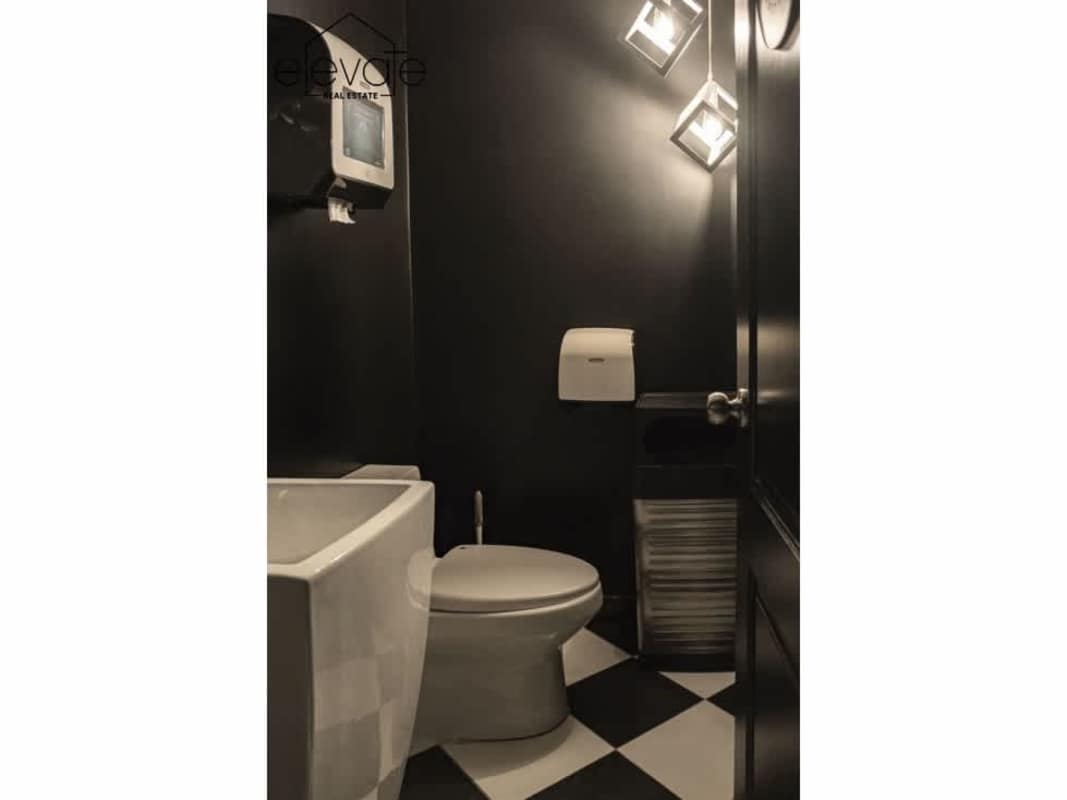 Large industrial kitchen with checkered flooring stainless prep space Casco Viejo Panama