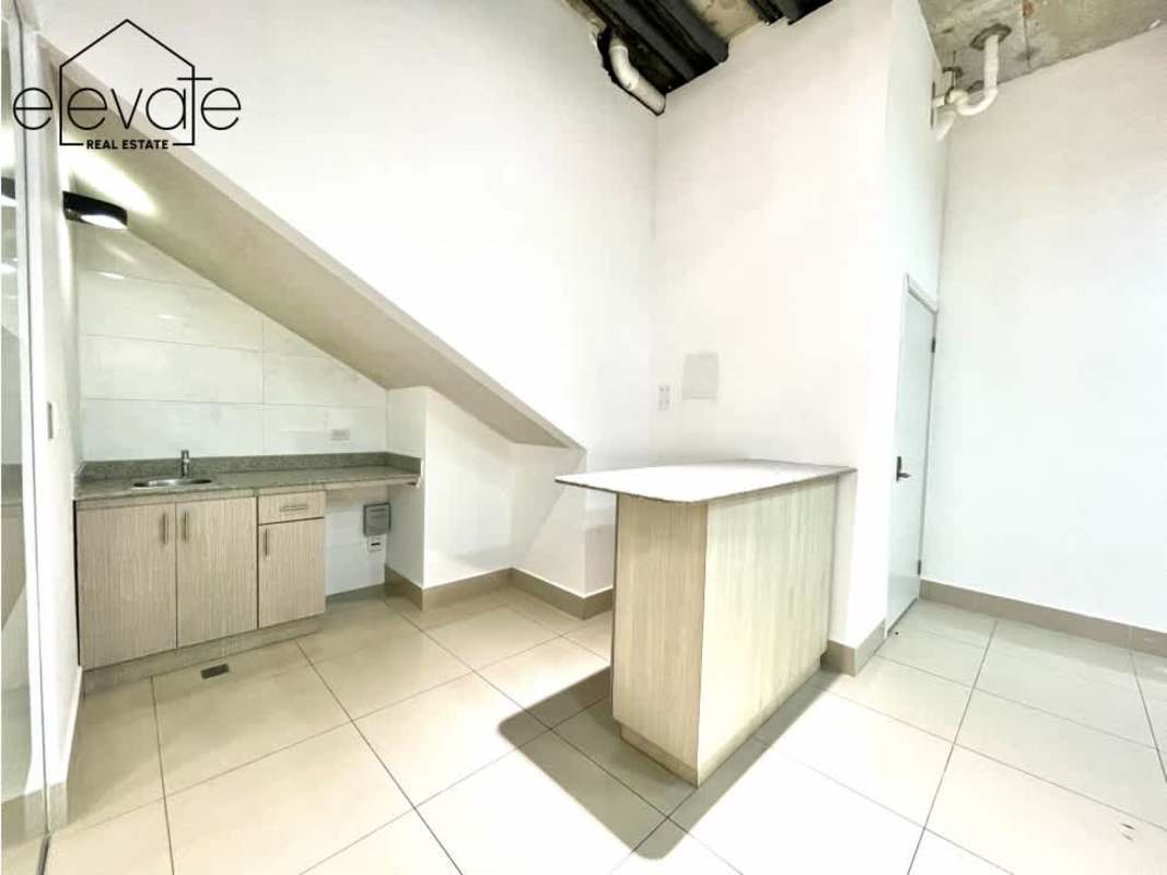 Modern commercial bathroom with mosaic accent wall and pedestal sink Plaza Habitat Panama City