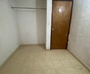 Hallway with green walls, beige tiled floor, multiple brown doors in Vacamonte Panama