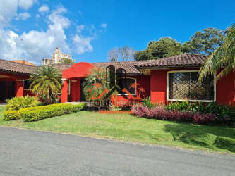 Living and dining area with tropical style, ceiling fans, tiled floor in luxury beach villa Coronado Panama