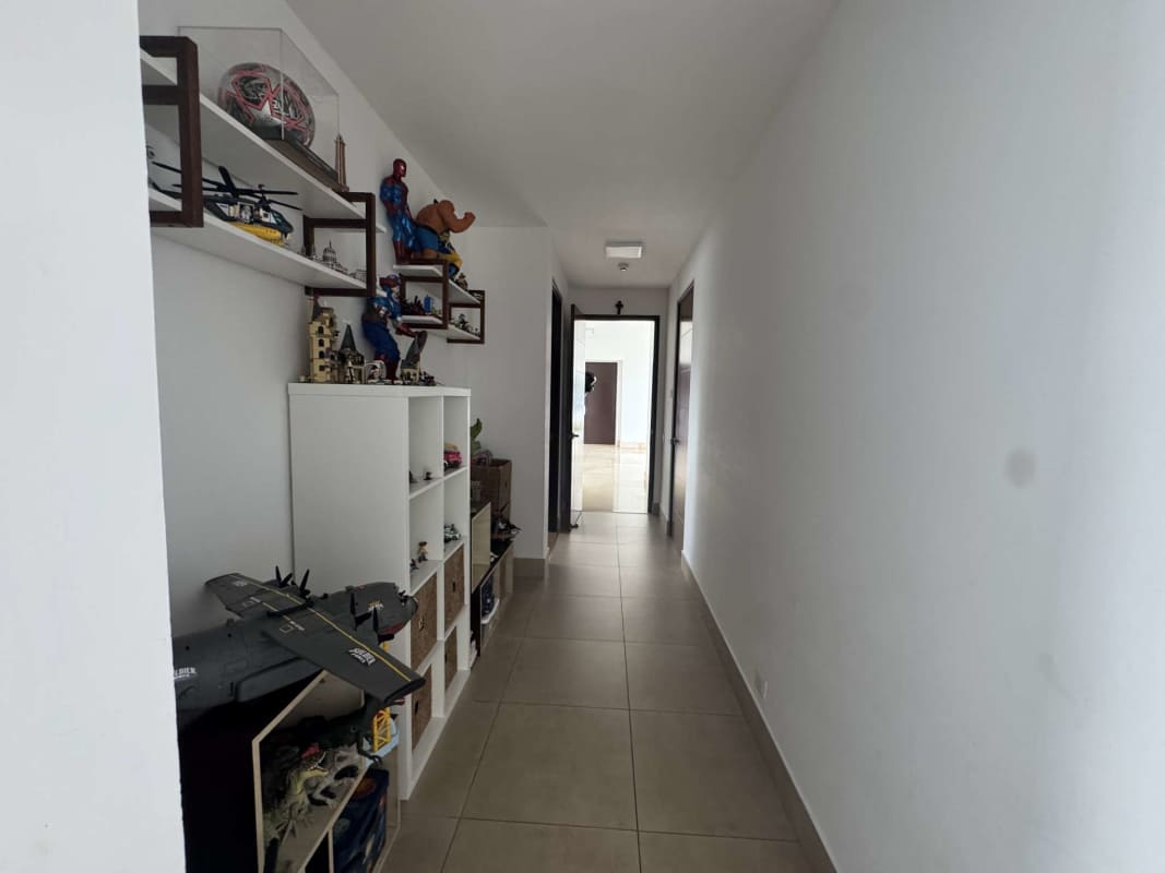 Elegant master bedroom with large windows, marble floors, ocean and city skyline views in PH Paramount Costa del Este Panama