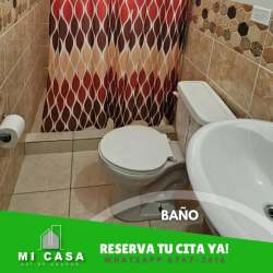 Bathroom with tiled walls, shower, and sink in furnished house Penonomé