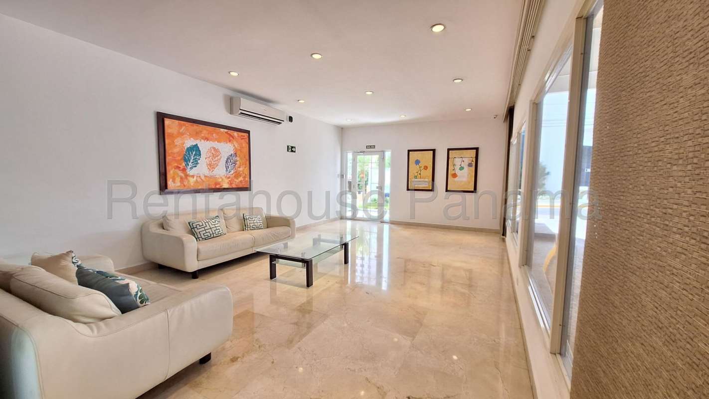 Lobby with marble floors and sofas PH Coco Mar San Francisco Panama