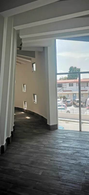 Modern corridor with curved window wall in Panama commercial building for rent Costa del Este