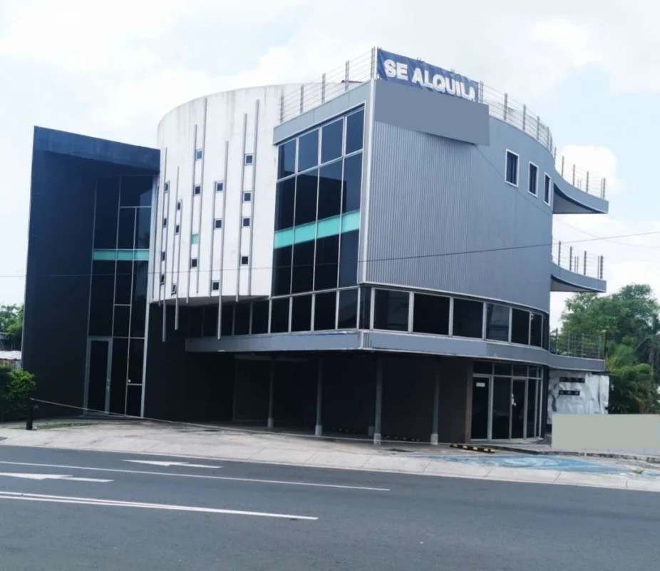 Large curved floor-to-ceiling windows with city skyline view inside Costa del Este Panama building for rent