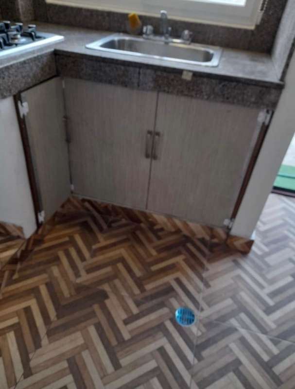 Kitchen with granite counter, stainless sink, patterned tile floor Diablo Panama apartment