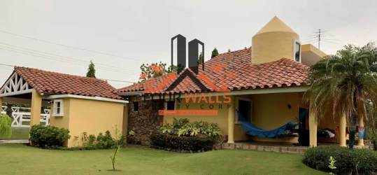 Spacious covered outdoor terrace and garden gazebo in a private Club Ecuestre Coronado house for sale Panama