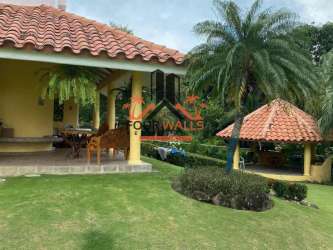 Spacious tropical garden with gazebo in house at Club Ecuestre Coronado Panama