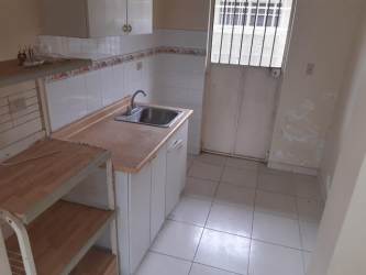 Empty living room with tiled floors bright walls in Valle Bonito La Chorrera Panama