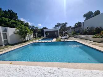Bright living room with contemporary furnishings and open layout in beach rental house Panama