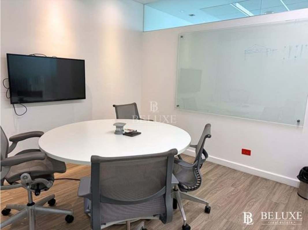 Corporate office lobby with glass walls, marble floors and reception counter Santa Maria Panama