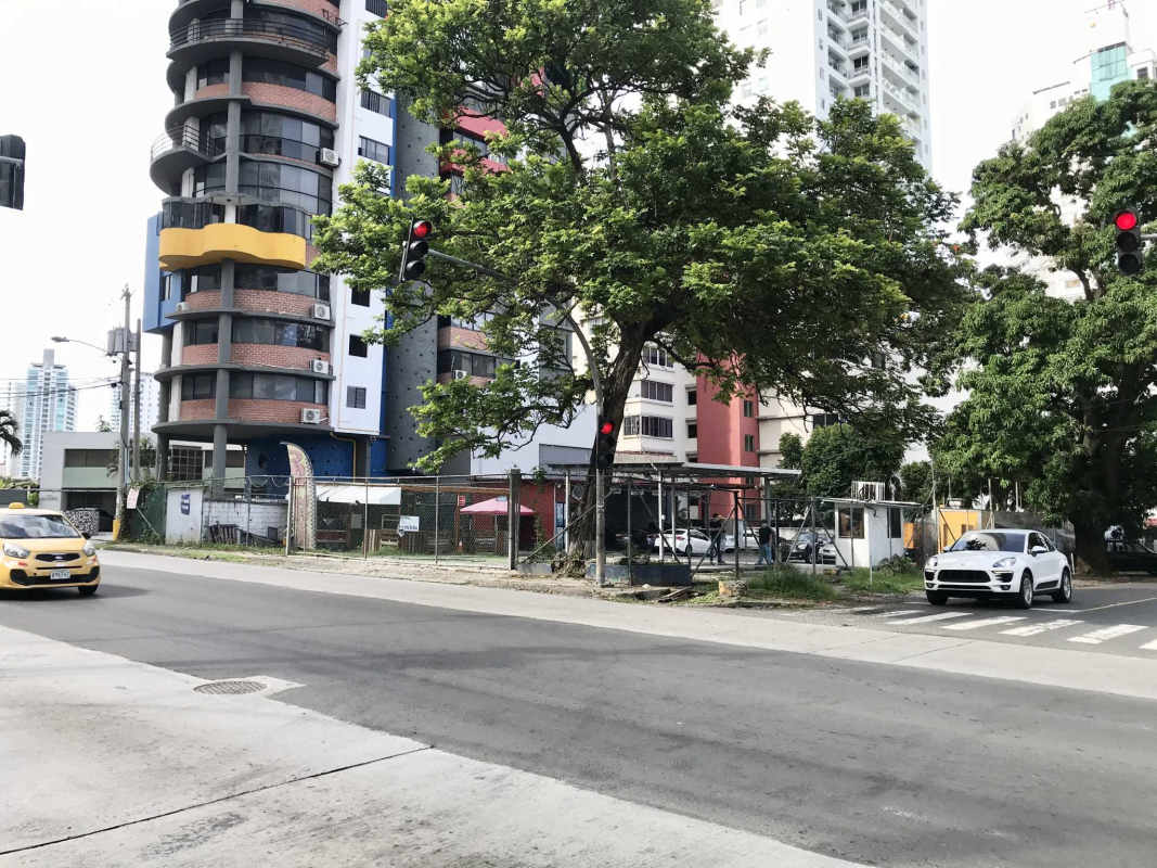 Residential towers with balconies next to empty corner lot in Coco del Mar Panama City
