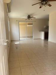 Spacious living room with tiled floor, ceiling fans, sliding door Arboledas Los Castaños