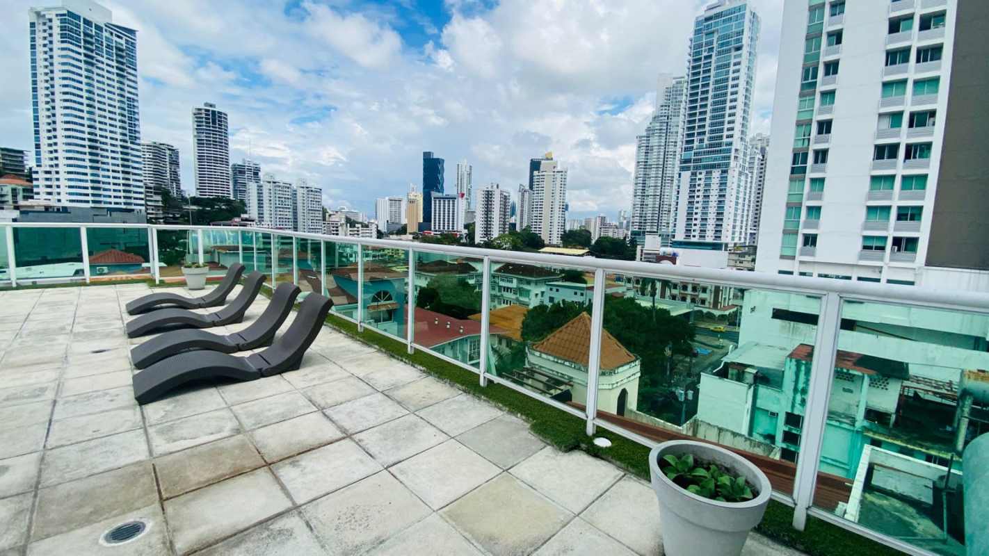Updated bathroom with glass shower enclosure, granite countertop sink in Bella Vista apartment Panama
