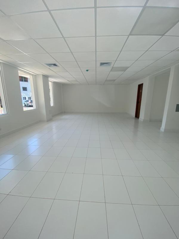Contemporary bathroom with tiled walls, modern toilet and sink at Quarry Heights Business Plaza Panama