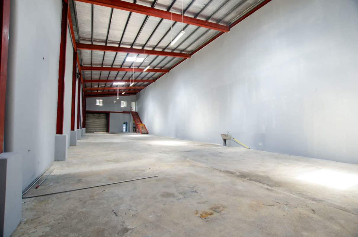Unfinished concrete utility room for storage in industrial warehouse at Llano Bonito Industrial Park Panama
