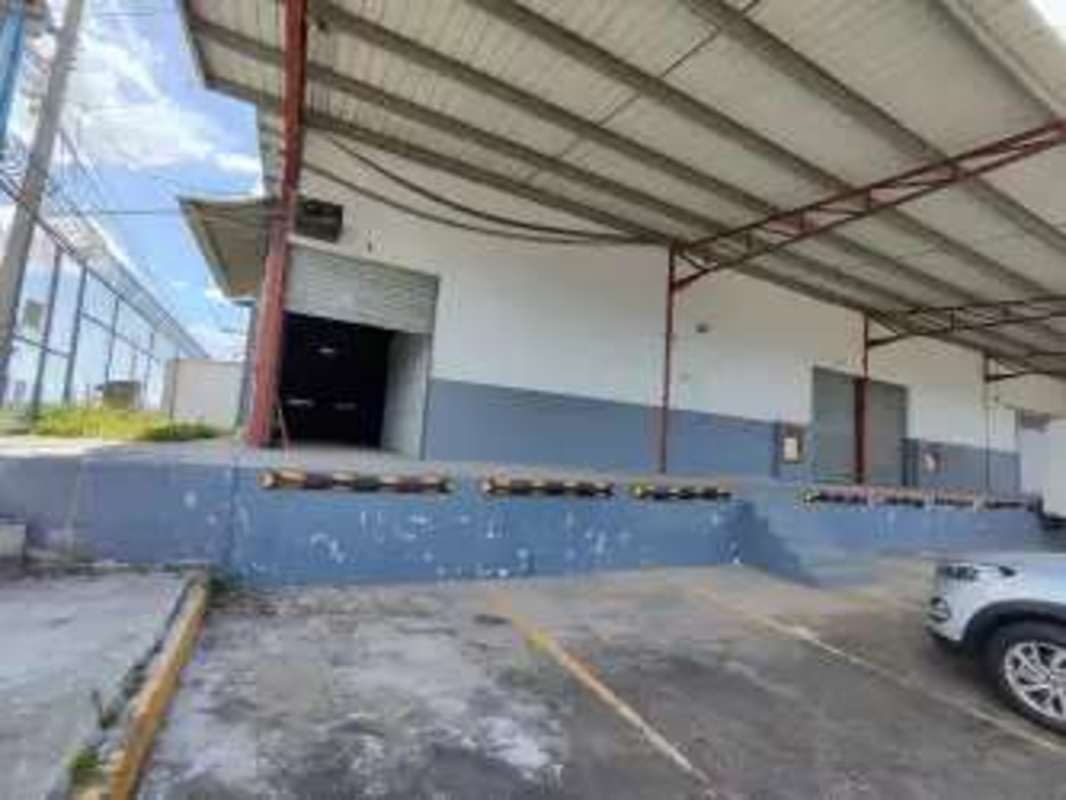 Spacious empty warehouse interior high ceilings steel beams mezzanine office Industrial Logistics Park Llano Bonito Panama