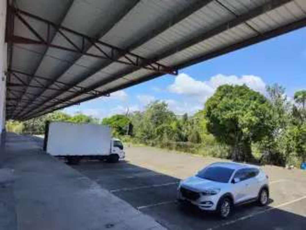 Warehouse with covered loading dock multiple parking spaces fenced secure entry in Industrial Logistics Park Llano Bonito Panama City
