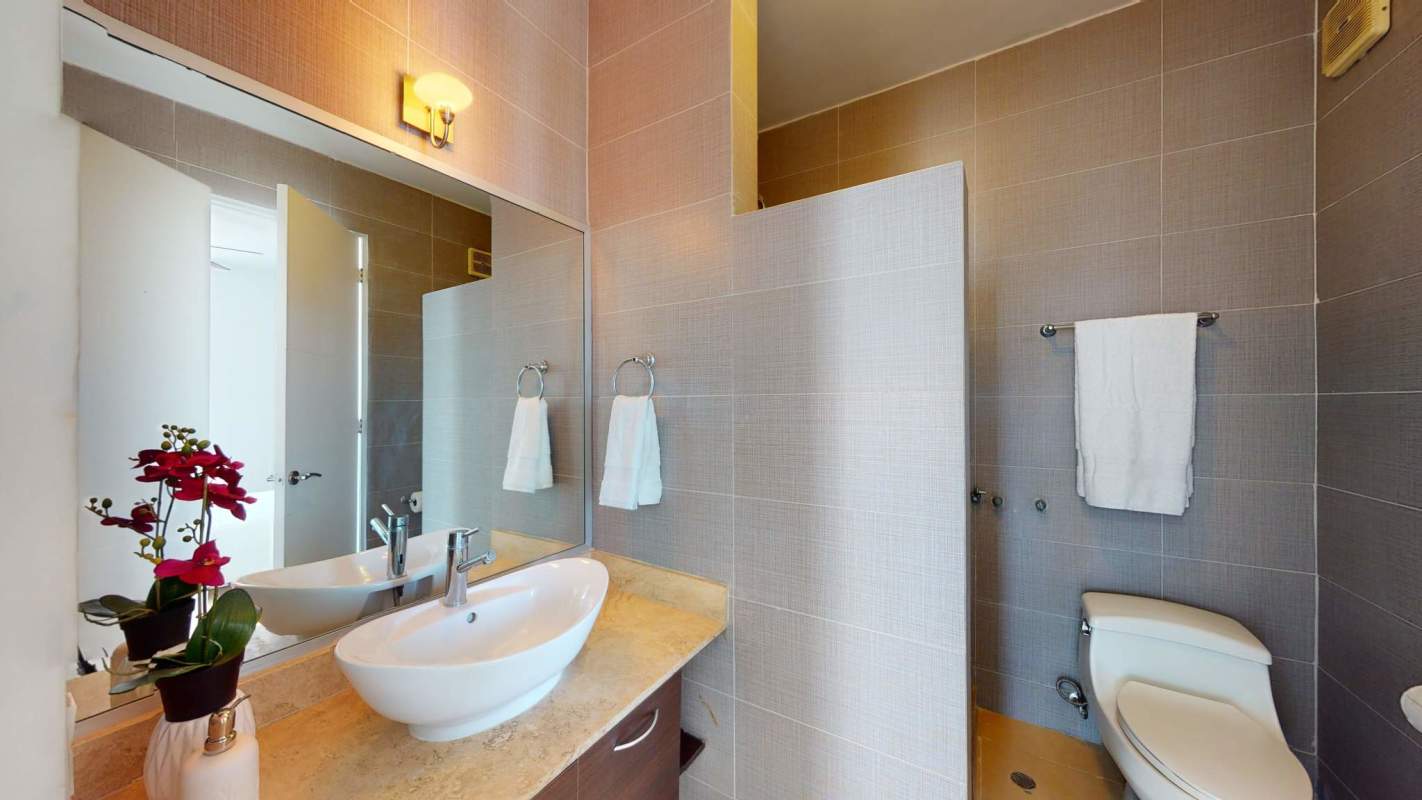 Bright open-plan living dining space with ocean skyline views in PH Sky Panama City