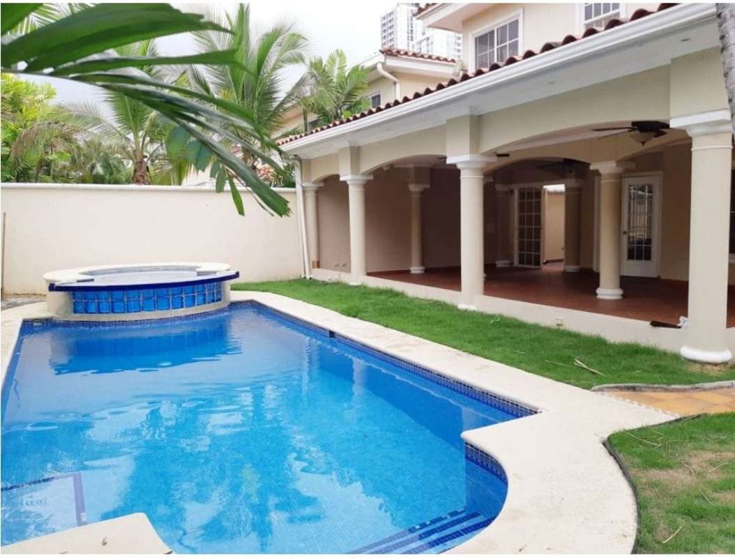 Spacious white kitchen with island granite countertops Costa Azul Panama