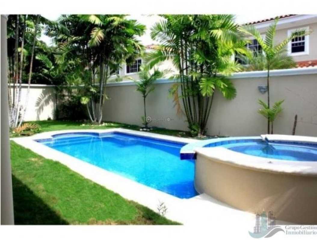 Spacious living room with large windows in luxury Costa Azul home Panama